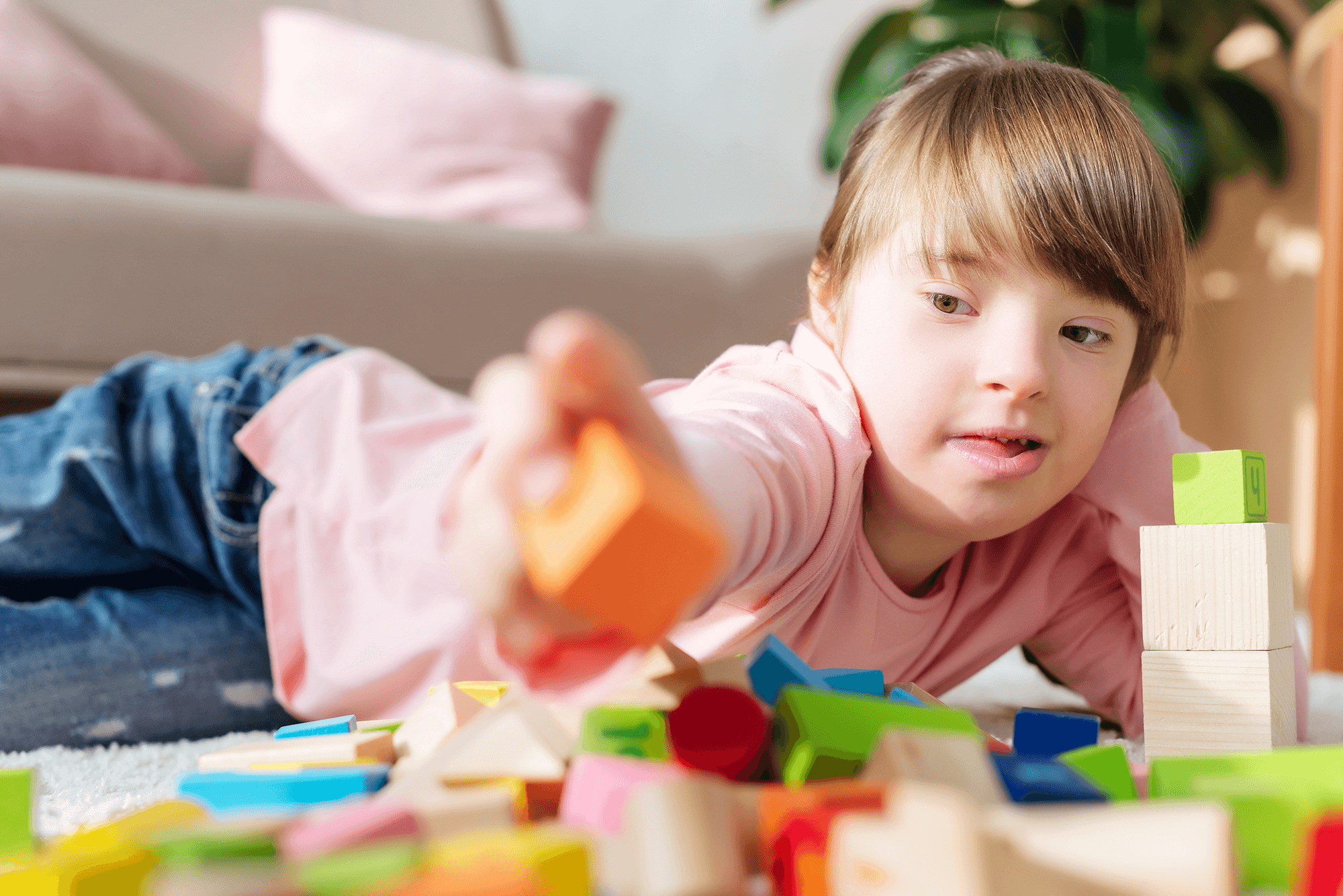 kid-with-down-syndrome-building-with-toy-cubes-2024-11-18-02-35-15-utc 1
